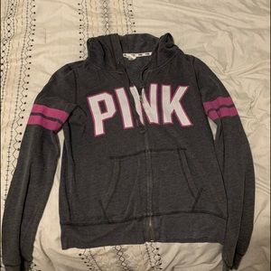 Pink zip up sweatshirt.